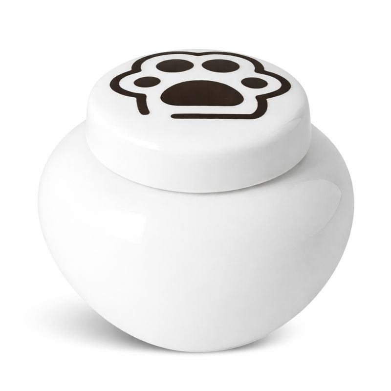 Witte keramische kattenurn met zwarte pootafdruk op het deksel