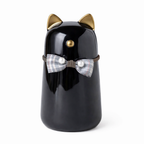 Urn in de vorm van een kat - gemaakt van zwart keramiek, met goudkleurige details en is voorzien van een schattig strikje