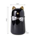 Katten urn 8 x 15 cm  - gemaakt van zwart keramiek, met goudkleurige details en is voorzien van een schattig strikje